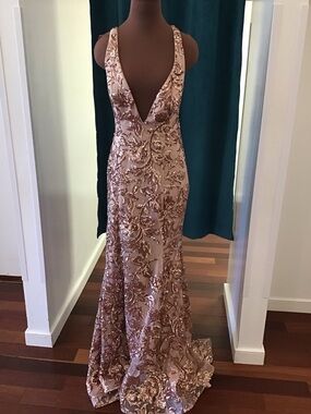 Jasz Couture fitted gown with open back and sequin appliqué